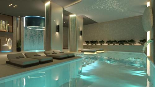 a living room with a large swimming pool at Hard Rock Hotel Malta in St. Julianʼs