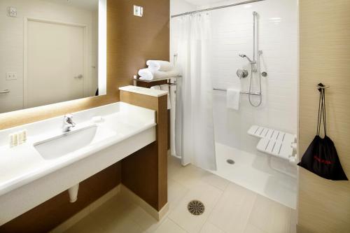 a bathroom with a sink and a shower at Fairfield by Marriott Inn & Suites Wheeling at The Highlands in Triadelphia