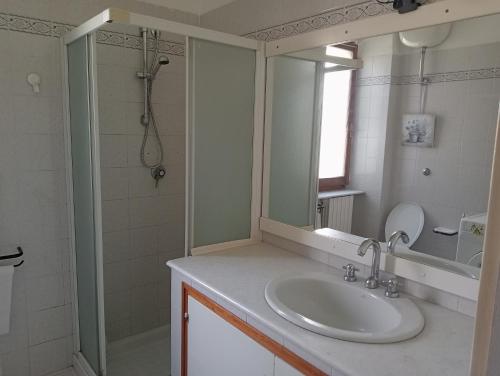 a bathroom with a sink and a shower at Casa Mirabella in Sirolo