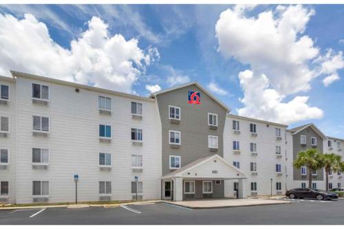 a large building with a k sign on the top of it at Studio 6 Extended Stay Fort Myers FL in Fort Myers