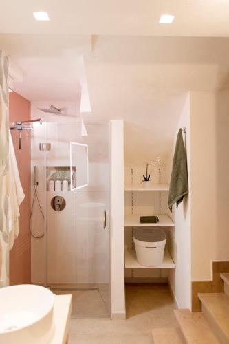 a bathroom with a shower and a sink at Suite Bobo in Monopoli