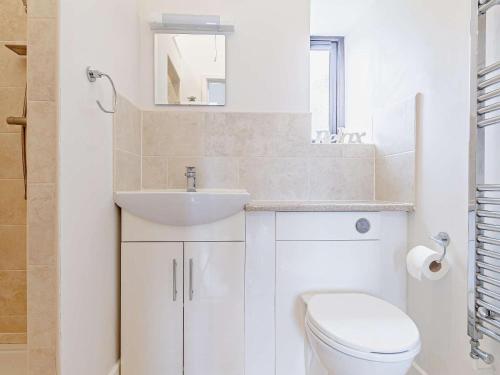 a white bathroom with a sink and a toilet at 2 Bed in Wellington oc-56950 in West Buckland