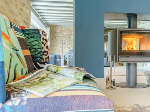 a room with a bed with a tv and a fireplace at 6 Bed in Richmond oc-80466 in Gilling
