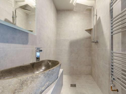 a bathroom with a sink and a tub at 6 Bed in Richmond oc-80466 in Gilling