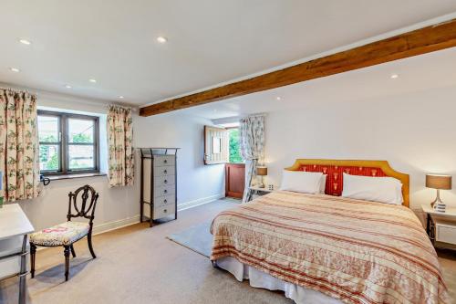 a bedroom with a large bed and a desk at 2 Bed in Askrigg oc-b27667 in Marsett
