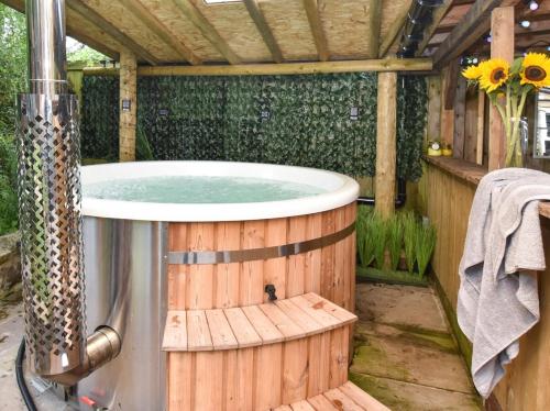 a jacuzzi tub in a wooden house at 2 Bed in Hexham oc-89086 in Bellingham