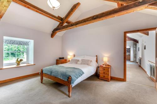 a bedroom with a bed and a mirror at 2 Bed in Belsay oc-t29653 in Bolam