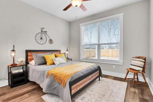 a bedroom with a bed and a ceiling fan at The Tipsy Twins - Entire Property in Canyon Lake