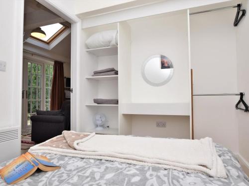 a bedroom with a bed and a mirror at 2 Bed in Middlesbrough oc-75544 in Stokesley