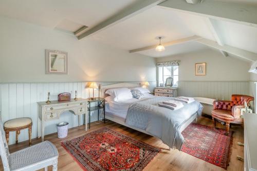 a bedroom with a bed and a desk and a chair at 2 Bed in Harmby oc-t30971 in Hornby