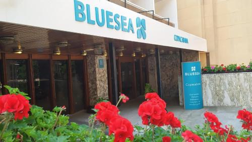 a building with red flowers in front of it at BLUESEA Copacabana in Lloret de Mar