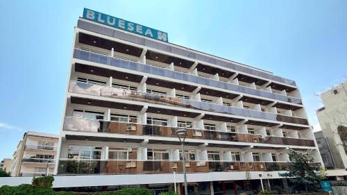 a hotel building with a sign on top of it at BLUESEA Copacabana in Lloret de Mar