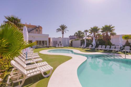 a swimming pool with lounge chairs and a resort at BLUESEA Brisa Roquetas in Roquetas de Mar