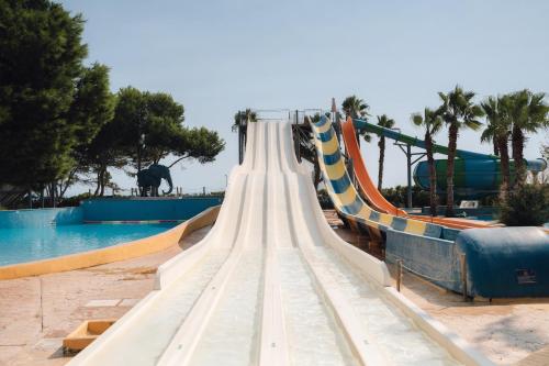 a long slide at a water park at BLUESEA Marina Parc in Na Macaret