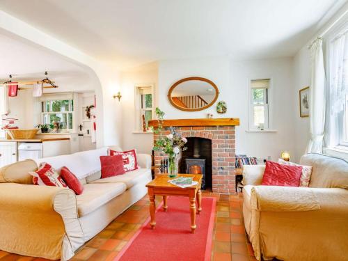 a living room with two couches and a fireplace at 2 Bed in Sway oc-nfl43 in Sway
