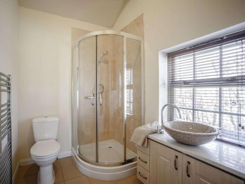 a bathroom with a shower and a sink and a toilet at 1 Bed in Hexham oc-82473 in Hexham