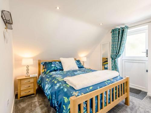 a bedroom with a bed and a window at 1 Bed in Weymouth oc-82098 in Osmington