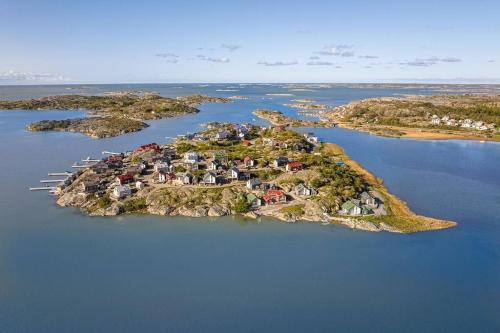 an island in the middle of a body of water at Seaside House for 6 with Panoramic Ocean Views and Sauna near Gothenburg in Kärna