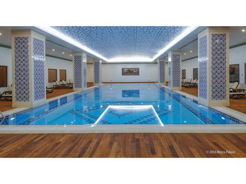 a large swimming pool in the middle of a building at Meyra Palace in Ankara