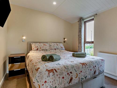 a bedroom with a bed and a window at 2 Bed in Sowerby Bridge oc-90887 in Sowerby Bridge