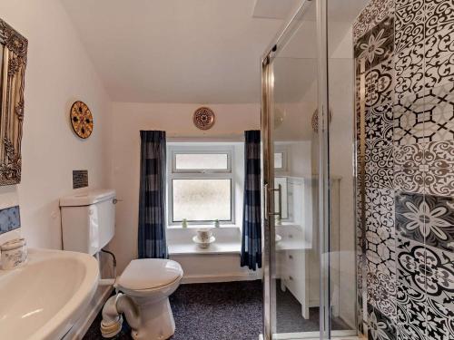 a bathroom with a toilet and a sink and a shower at 2 Bed in Consett oc-91440 in Hunstanworth