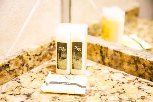 a tube of toothpaste sitting on a counter in a bathroom at Nobile Hotel Premier Hill in Asunción