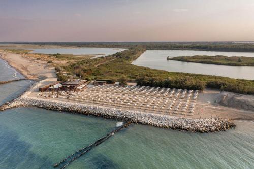 an aerial view of an island in the water at Glamping Lido di Spina in Lido di Spina