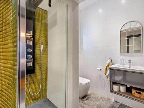 a bathroom with a shower and a toilet and a sink at 3 Bed in Sheffield oc-94342 in Thurlstone
