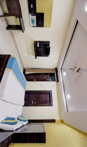 a small room with a bed and a window at Hotel Park in Lucknow