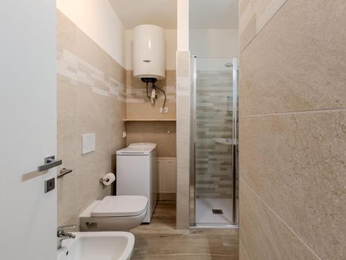 a bathroom with a toilet and a sink and a shower at Apartment Ilaria by Interhome in Riva del Garda