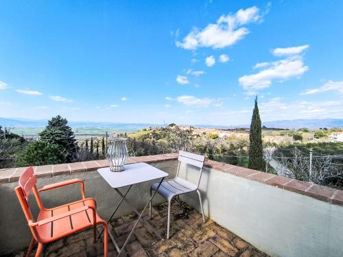 a table and two chairs on a balcony with a view at Holiday Home Nobile by Interhome in Polveraia