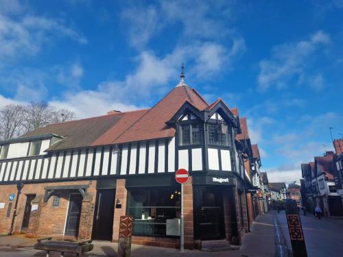 a building with a red stop sign in front of it at City Centre perfect for exploring Chester in Chester