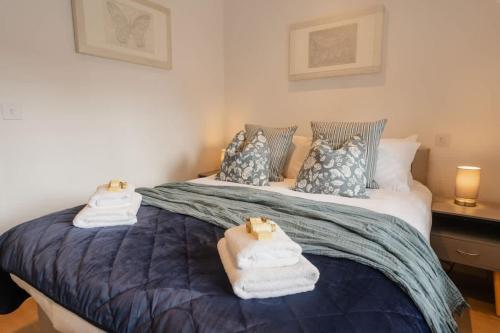 a bedroom with a large bed with towels on it at City Centre perfect for exploring Chester in Chester