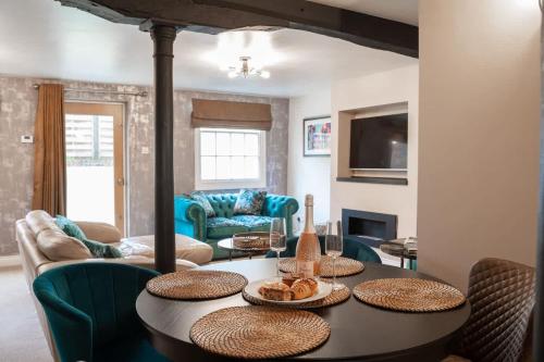 a living room with a table and chairs at 2 Bed - City Centre on your doorstep Parking in Chester