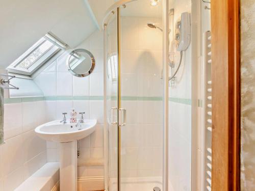 a bathroom with a sink and a shower at 3 Bed in Backworth oc-cn013 in Backworth