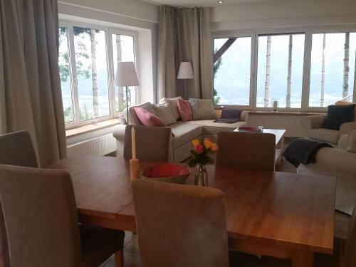 a living room with a table and a couch at Apartment Jacob by Interhome in Dölsach
