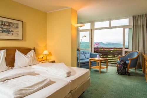 A bed or beds in a room at Hotel Regina