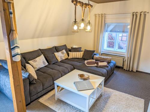 a living room with a couch and a table at Apartment Graugans by Interhome in Freiburg - Elbe