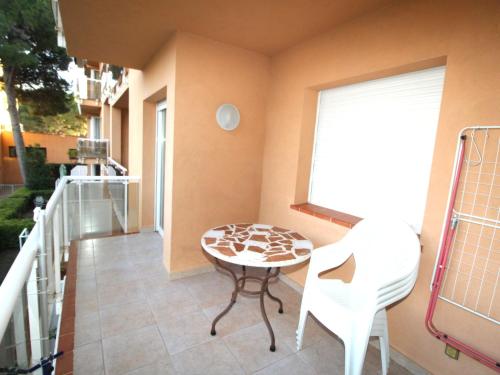 a small table and chairs on a balcony at Apartment Sa Guilla by Interhome in Pals