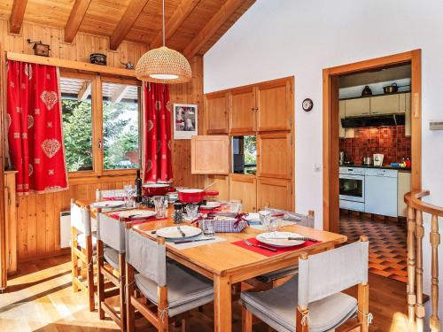 a dining room with a wooden table and chairs at Chalet Veni- Vidi- Mansi by Interhome in Champex