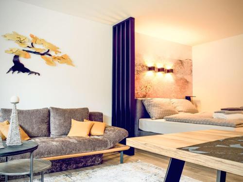 a living room with a couch and a table at Apartment Grubhof by Interhome in Scheffsnoth