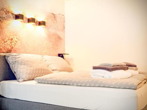 a white bed with towels on top of it at Apartment Grubhof by Interhome in Scheffsnoth