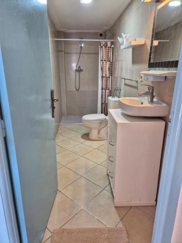 a bathroom with a sink and a toilet at Terre d'Océan in Taghazout