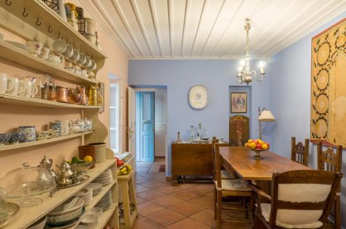a kitchen with a table and a dining room at Acropolis Villa in Plaka in Athens