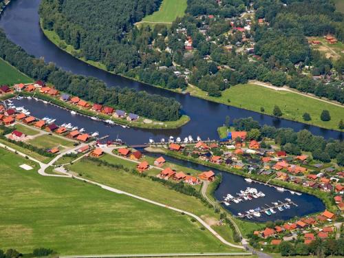 an aerial view of a village with a river at Chalet Emsblick in Walchum