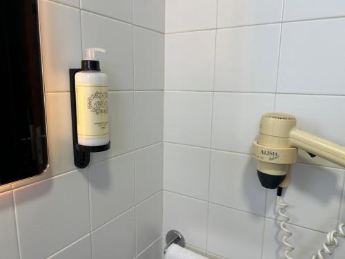 a room with a blow dryer on a wall at Flag Hotel Campo Maior in Campo Maior