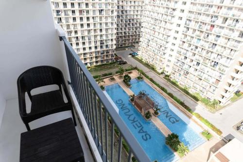 a view of a pool from the balcony of a building at Affordable Condo in Cebu with Great Views in Suba