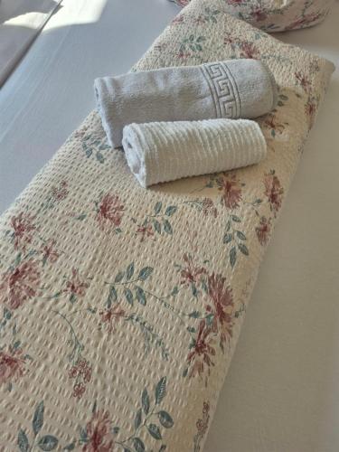 a rolled up towel sitting on top of a table at Gasthaus Staufenbrücke in Bad Reichenhall