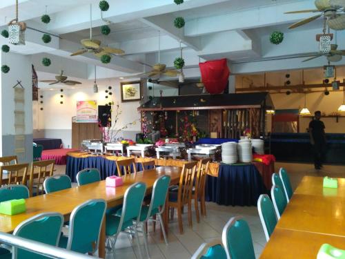 Ресторант или друго място за хранене в Lumut Apartment