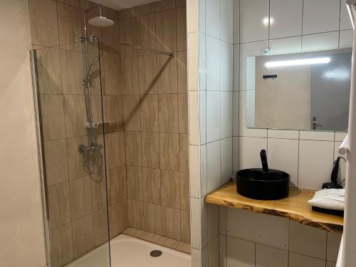 a bathroom with a shower with a glass door at au point du jour Ch3 in Récourt-le-Creux